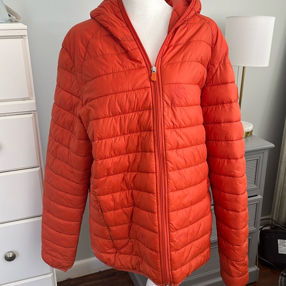 Save The Duck orange puffer Men’s Jacket , with a small stain .